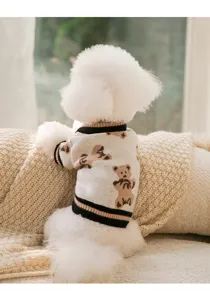 Close-up of cute all-over bear pattern knit pet sweater back view cozy home setting detail view.