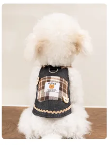 Denim dog dress detail featuring cute plaid pocket, bear button and label for spring summer.
