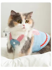 Cute cat denim overall dress with red plaid straps and lace, perfect spring pet apparel.