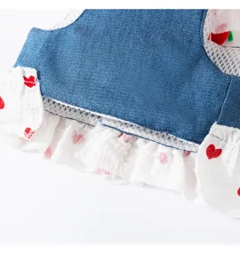 Cute denim dog harness skirt with strawberry decor and sweet heart ruffled mesh hem for small pets.