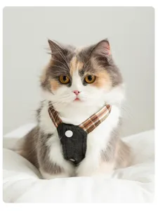 Cute plaid denim pet harness skirt for cats and dogs, stylish spring summer apparel detail view.