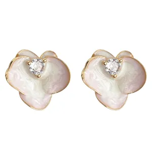 Detailed shot of pink gradient enamel phalaenopsis ear studs with sparkling zirconia.