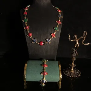 Exquisite gold-plated enamel ladybug necklace bracelet set, vintage insect jewelry detail view.