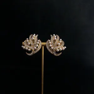 Vintage baroque pearl floral earrings with sparkling rhinestones, elegant gold-toned design.