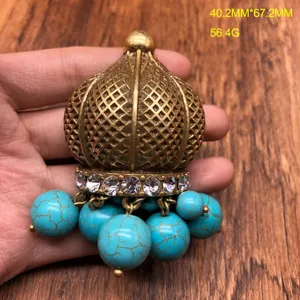 Vintage antique gold-tone jhumka pendant brooch with turquoise beads and crystal rhinestones.