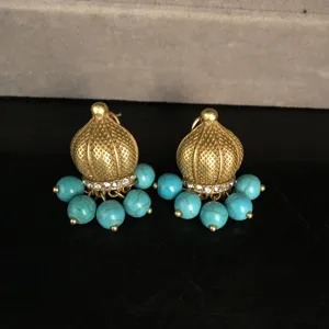 Vintage gold-toned turquoise beaded jhumka stud earrings detailed with rhinestones.