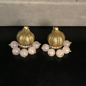 Vintage gold tone domed jhumka earrings with hanging pink beads and crystal details