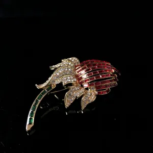 Exquisite vintage rhinestone flower brooch detail, sparkling crystal details on gold tone metal.