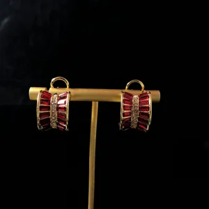 Vintage gold-plated red rhinestone hoop earrings detail, elegant retro design accessory.