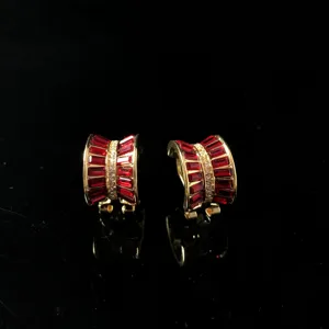 Vintage gold-plated clip-on earrings featuring striking red baguette stones and clear rhinestones.
