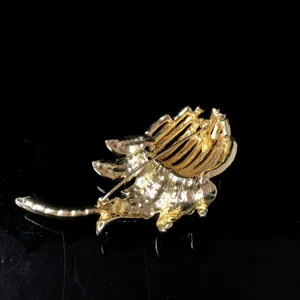 Vintage gold-plated floral brooch back view, exquisite retro detailed design accessory.