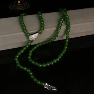 Exquisite green beaded necklace featuring a dazzling snake head charm with sparkling zircon stones.