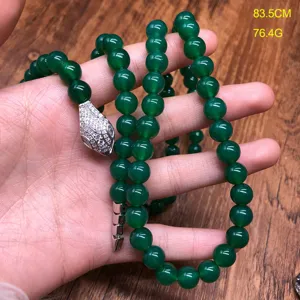 Green gemstone beaded necklace detail view, showing snake head pendant and length 83.5cm.