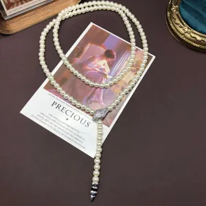 Vintage luxury pearl necklace with sparkling zircon snake head pendant and elegant double layered design.