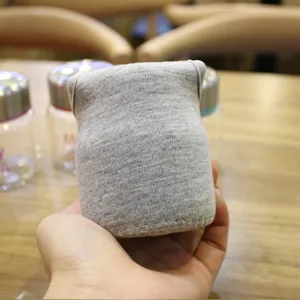 Grey knitted cup sleeve protective cover for mini glass bottles portable reusable cozy cup.