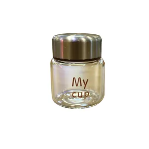 Mini portable glass cup with metallic lid, cute clear water bottle for daily use.