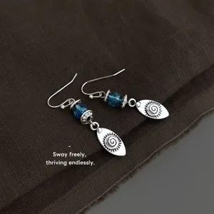 Vintage blue beaded dangle earrings with spiral sun charms, retro bohemian style drop earrings.