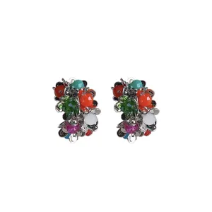 Close-up of colorful floral cluster earrings featuring vibrant multicolored gemstone details.