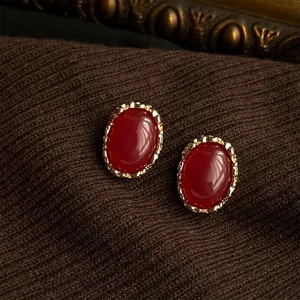 French vintage dark red oval earrings with ornate gold bezel, elegant retro style jewelry.