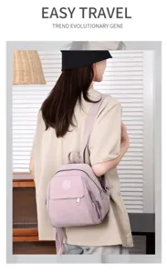 Detail view of a stylish women's mini backpack in light purple oxford fabric, casual travel bag.