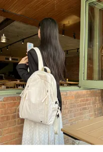 Casual lightweight waterproof backpack for daily travel and school, elegant off-white style detail.