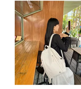 Casual white school backpack for women and students, lightweight and spacious detail view.
