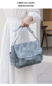 Stylish vintage messenger bag for women, large capacity casual shoulder bag with wide strap.