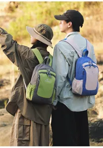 Outdoor casual backpack detail view showing color-blocked design, front pocket and durable straps.