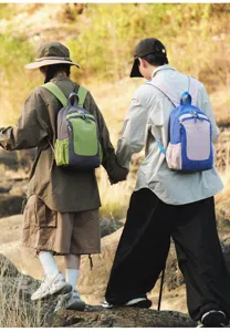 Outdoor lifestyle detail view of colorful casual backpack worn during walking, large capacity style.