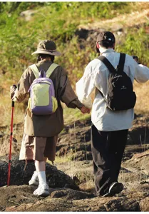 Outdoor travel backpack detail showing durable straps and color block design for hiking.