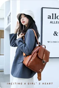 Detail view of stylish brown leather backpack for women, featuring ample capacity and chic design.