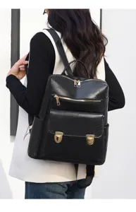 Schwarzer Damen-Rucksack aus Leder im Detail, mit goldenen Reißverschlüssen für den täglichen Weg.