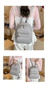 Casual grey leather backpack for women, stylish multi-pocket daypack with zipper closure.