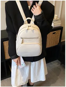 Stylish white pebbled leather mini backpack for women, casual daily wear dual-strap school bag.
