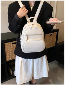Stylish white leather backpack for women, casual daily travel small school bag with zipper.