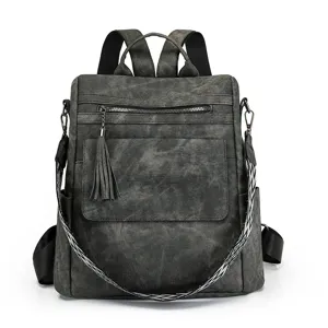 Sac à Dos de Voyage Scolaire Antivol en Cuir PU Décontracté Mode pour Femmes Avec Pendentif Pompon Couleur Unie Multi-Poches