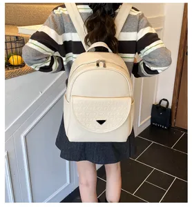 Solid color PU leather women backpack with front pocket and chic design for daily use.