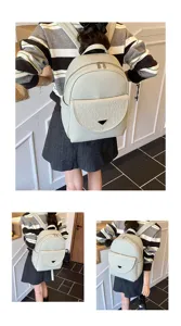 Detail view of the stylish solid color PU leather women backpack, showcasing front pocket.
