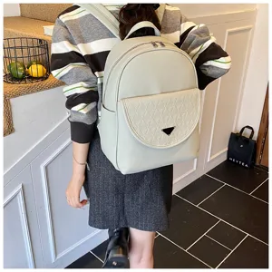 Light green PU leather fashion backpack with flap front pocket and metal triangle design