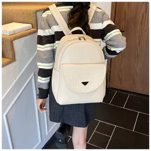 Solid color PU leather backpack for women, trendy travel bag with large capacity and stylish design.