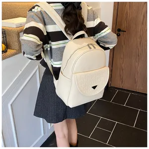 Elegant women's PU leather backpack in solid color, stylish casual travel daypack for daily use.