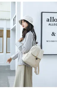 Fashion women's backpack 2025 new vintage style daily casual travel bag with cute cat pendant.