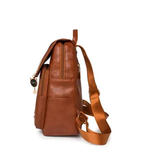 Side detail view of brown PU leather women backpack with cute cat pendant and zippers.