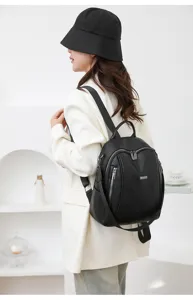 Detail view of a stylish black leather backpack for women, ideal for daily commute and casual use.