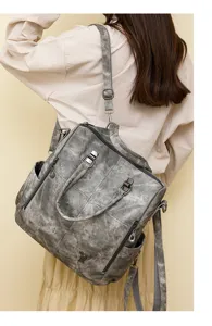 Grey soft leather multi-functional backpack and shoulder bag detail view showing daily style.