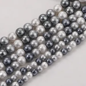 Close-up of mixed color wrinkled cotton pearl beads for DIY jewelry craft making