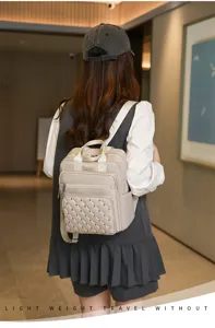 Stylish quilted stud backpack for women, large capacity casual daily travel school bag.
