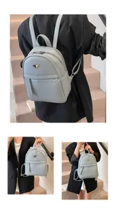 Details of casual PU leather women backpack with multi compartments and chic design for travel.