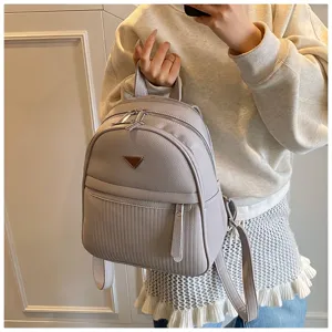 Stylish women's PU leather backpack, casual lightweight daypack with multi-zipper design.