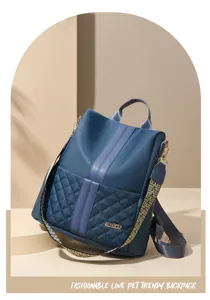 Detailed view of the blue nylon quilted backpack with vertical stripes and chic pattern straps.